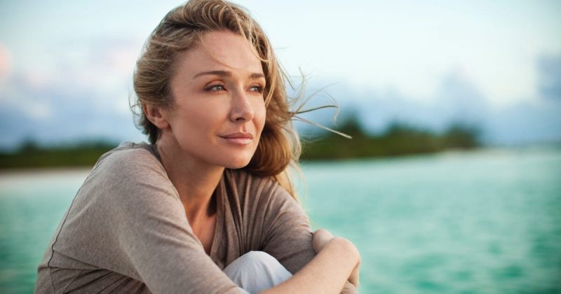 Photo of Alexandra Cousteau sitting in front of ocean