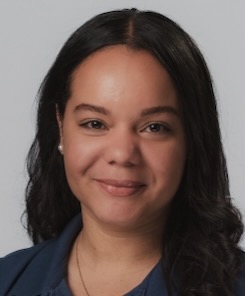 Photo of Nikki Sanchez wearing a dark blue top
